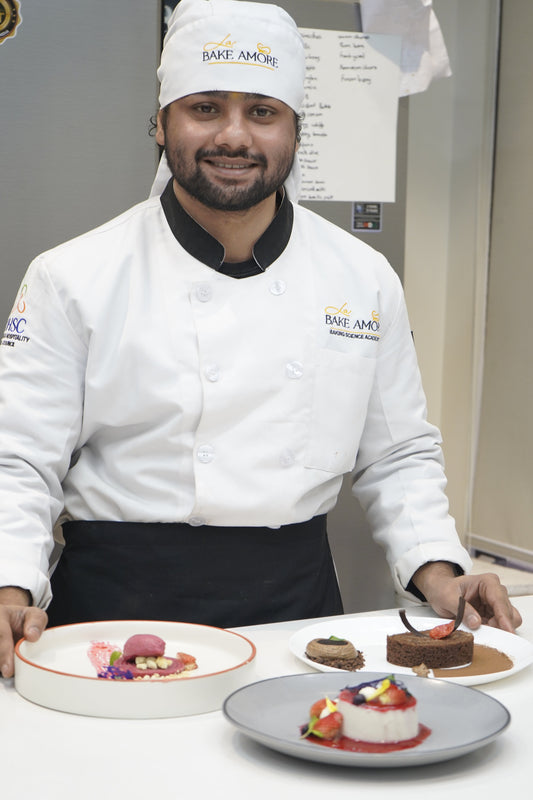Chef in a professional kitchen with a focus on desserts